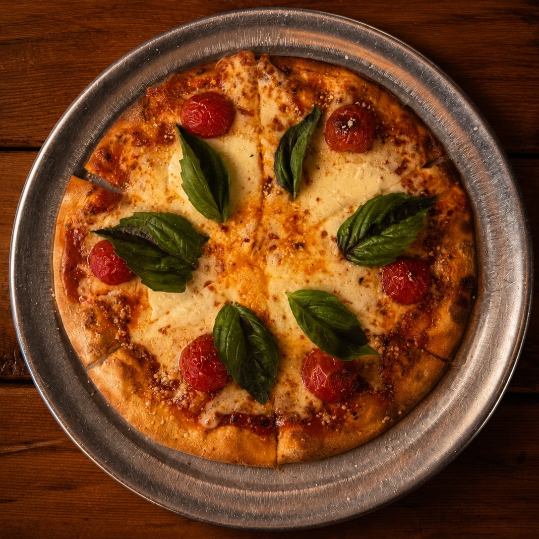 Aster Margherita flatbread with tomatoes, mozzarella and basil