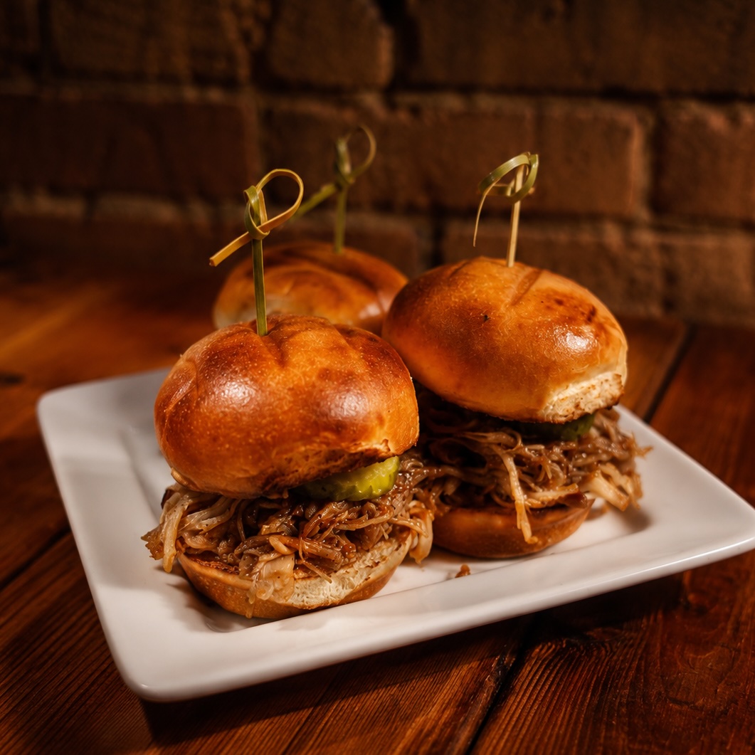 Pulled pork sliders with citrus chipotle BBQ sauce and pickles